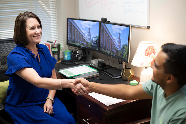 A photo of a career coach working with a student.
