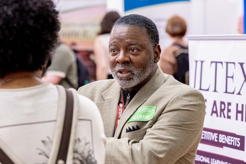 A UNT alumni at a Career Fair