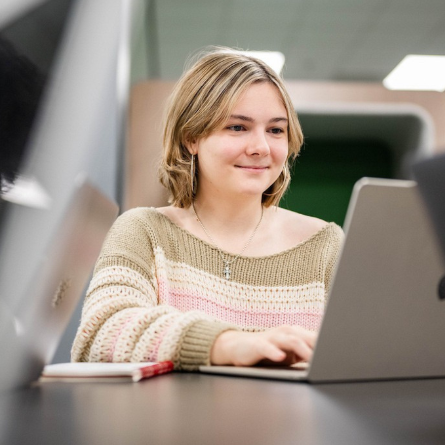 Female student looking at her laptops.