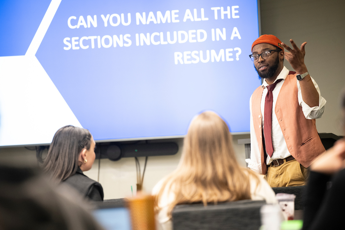 An image of a Career Center staff member teaching students how to write a resume.