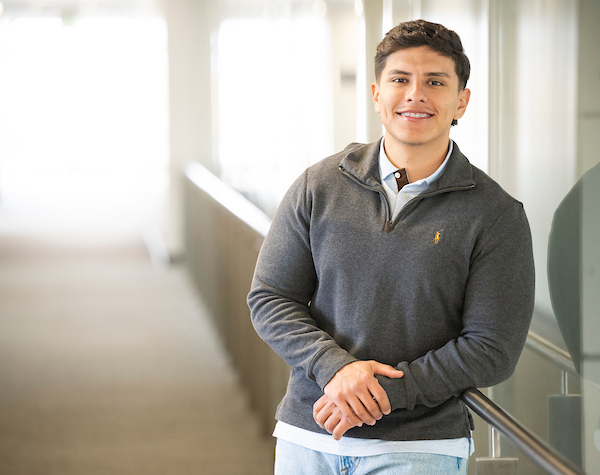 A photo of UNT alumna Manny whose internship transitioned into a full-time job.